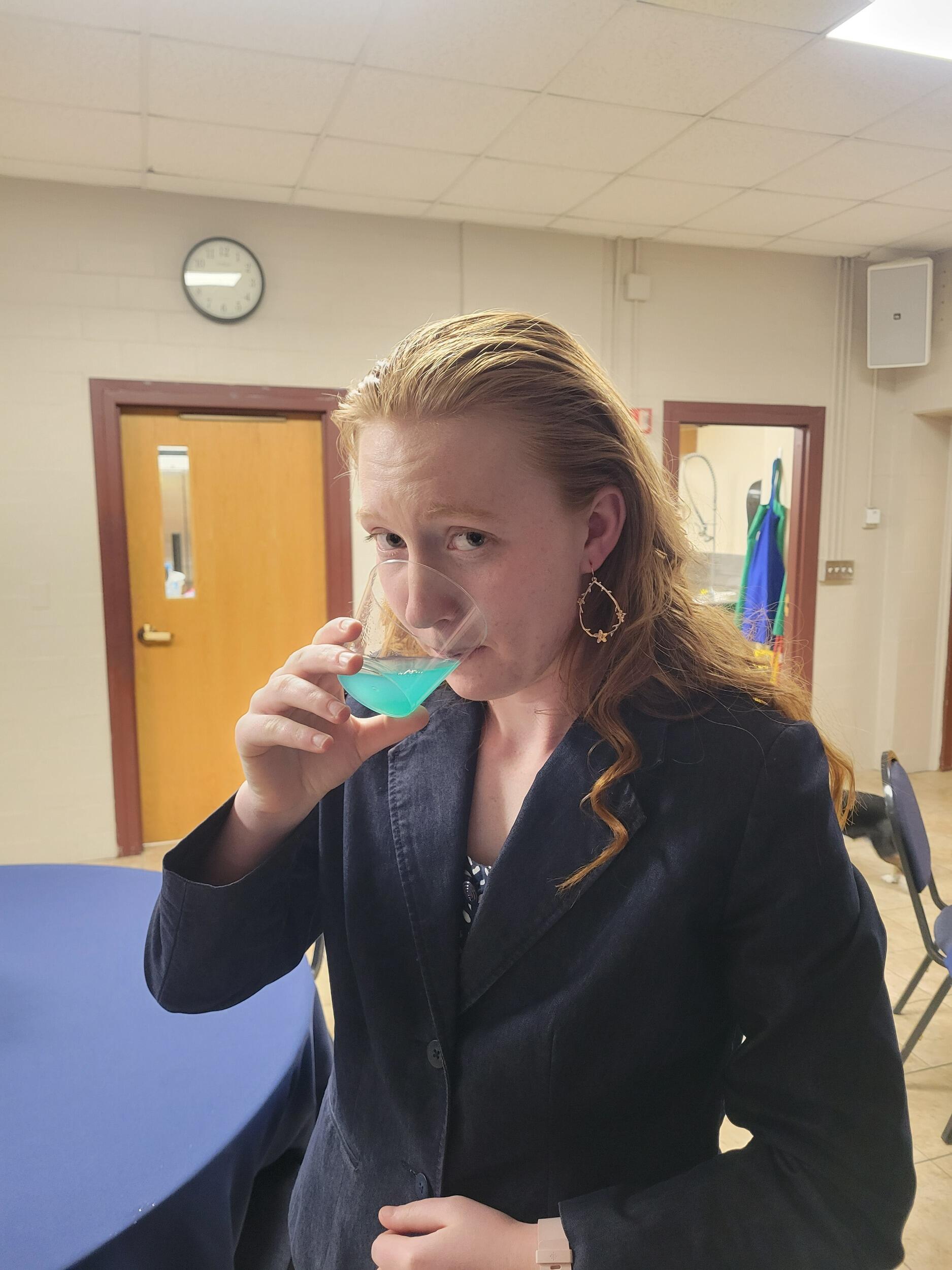 Lydia is "drinking the blue kool-aid" at the Newman Formal.