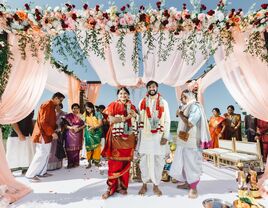 Couple posing for a wedding portrait during their traditional ceremony