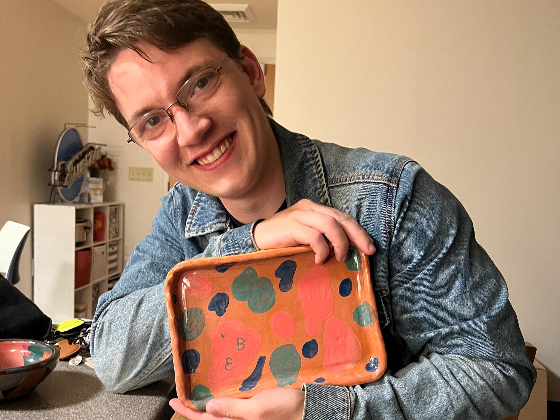 Elijah holding the plate Brittney made him