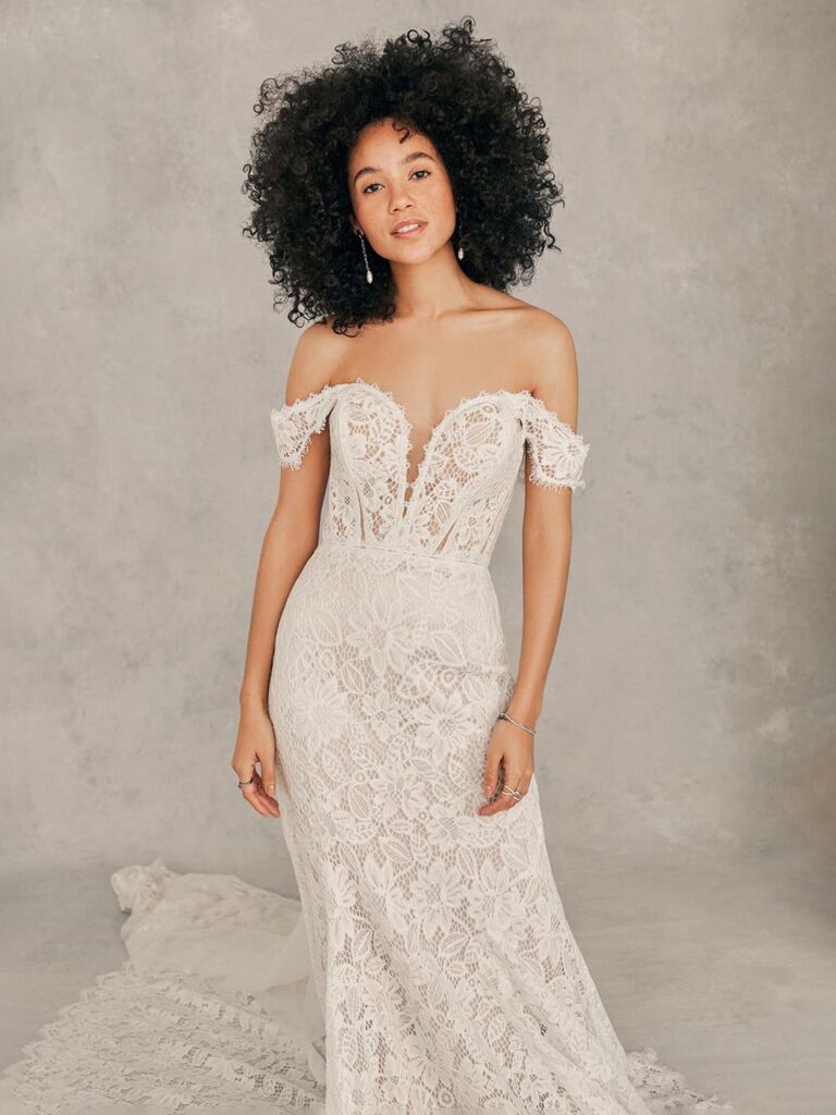 madison james white sheath wedding dress with sweetheart neckline with deep v off the shoulder lace sleeves lace chest and form fitting flowy lace skirt