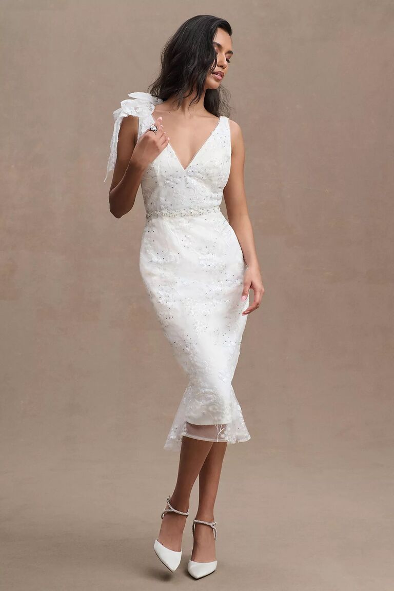 Mid-length sparkly wedding dress by Mac Duggal. 