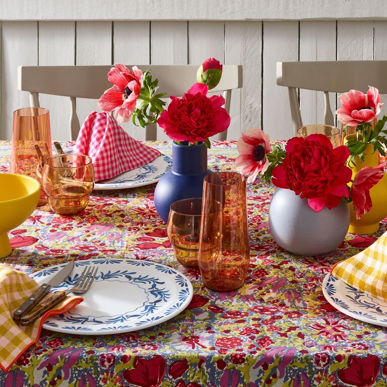 Colorful floral tablecloth rehearsal dinner decor