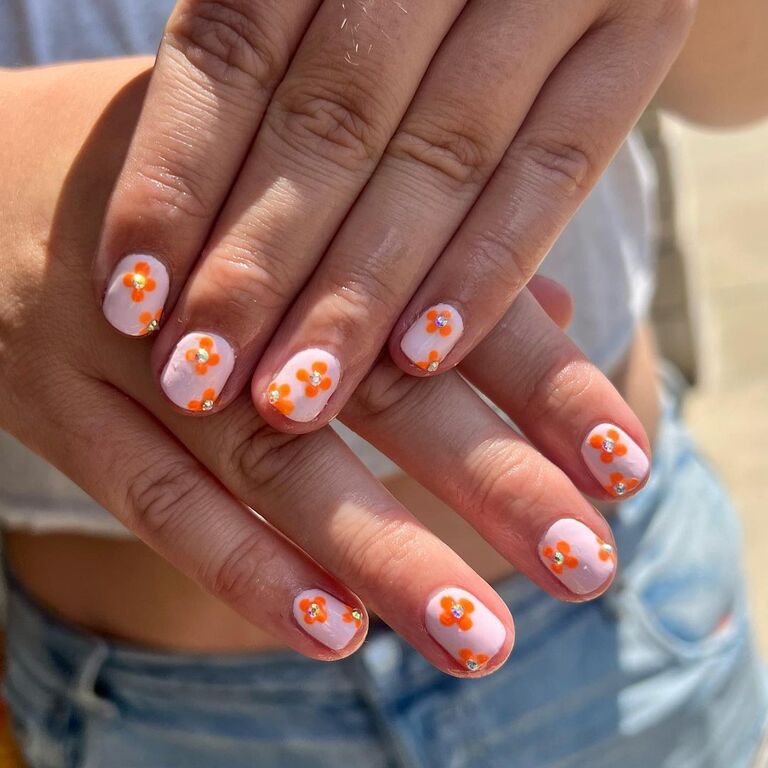 orange flower wedding nail inspo