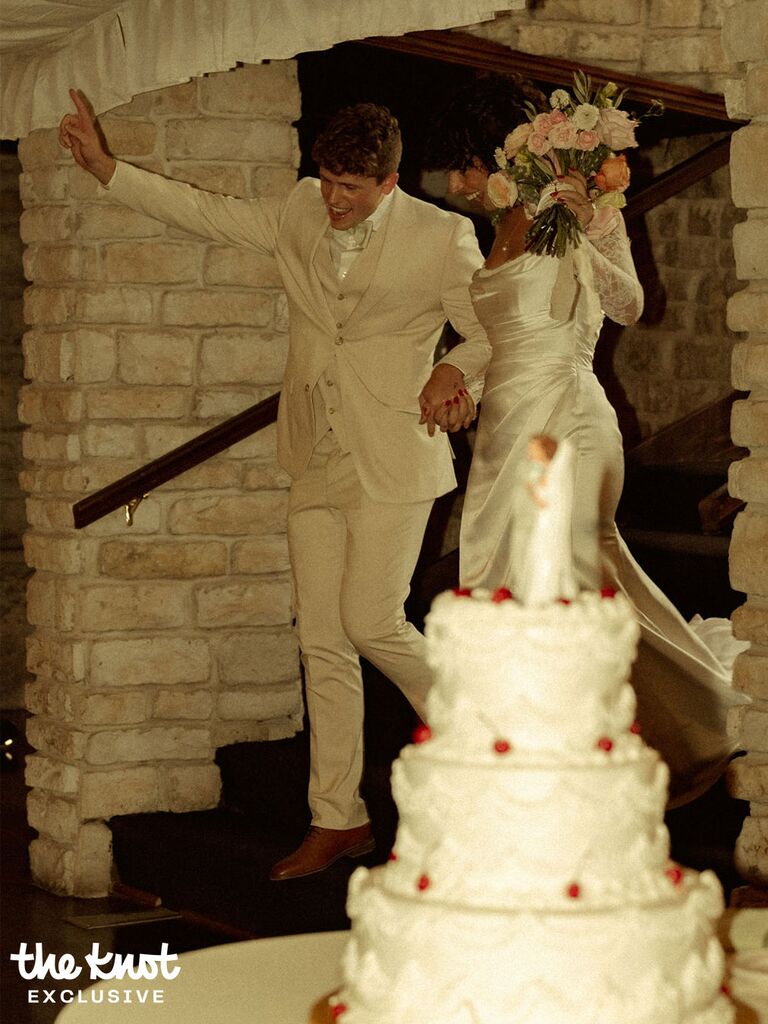 Tommy Winkler and his wife Jessica entering their wedding reception