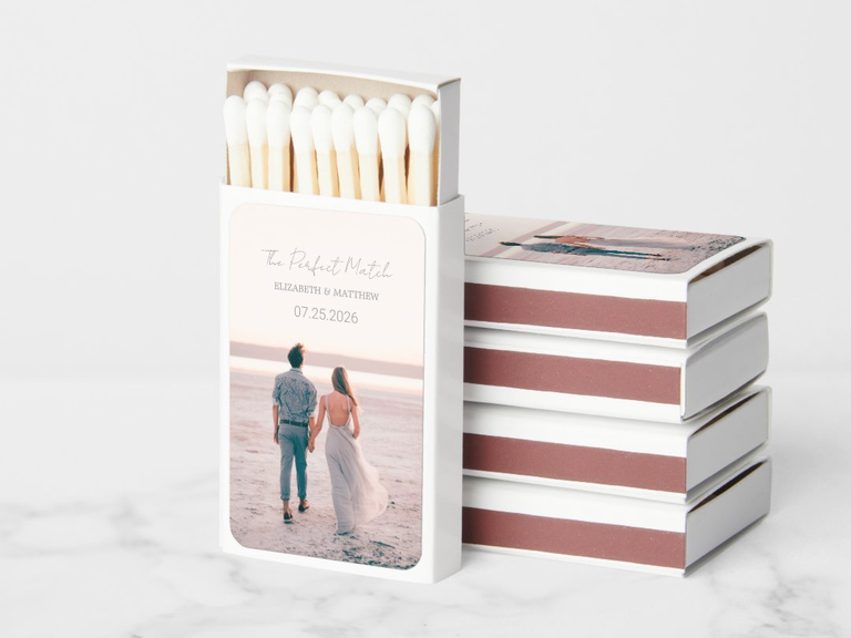 Custom matchboxes with a photo from an engagement shoot on the cover and personalized text overlayed
