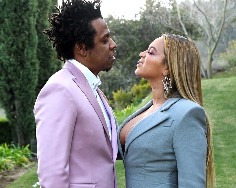 Beyonce and Jay Z attend ROC Nation brunch in January 2020 in LA look at each other in a meadow