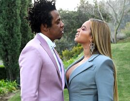 Beyonce and Jay Z attend ROC Nation brunch in January 2020 in LA look at each other in a meadow