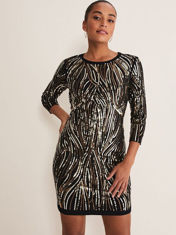 A long sleeve, open back sequin knit dress in black with silver and gold detailing from Phase Eight