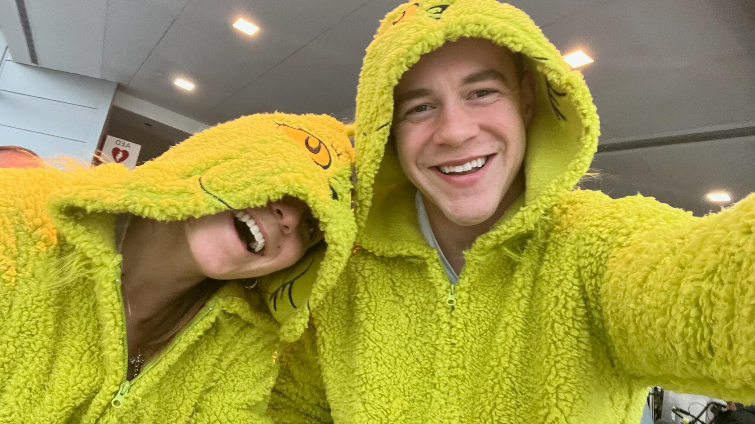 Two Grinch lovers traveling in comfort. Not too many people who love the Grinch as much as these two.