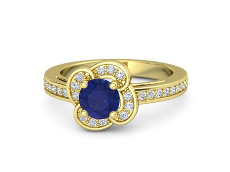 gemvara flower engagement ring with round sapphire round moissanite and yellow gold flower halo and round moissanite and yellow gold band