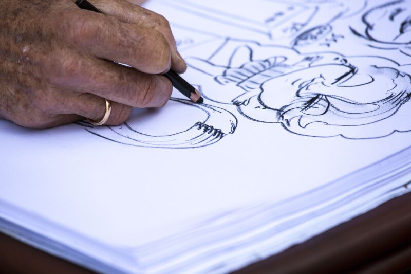 Wednesday Party Theme Ideas: caricature artist