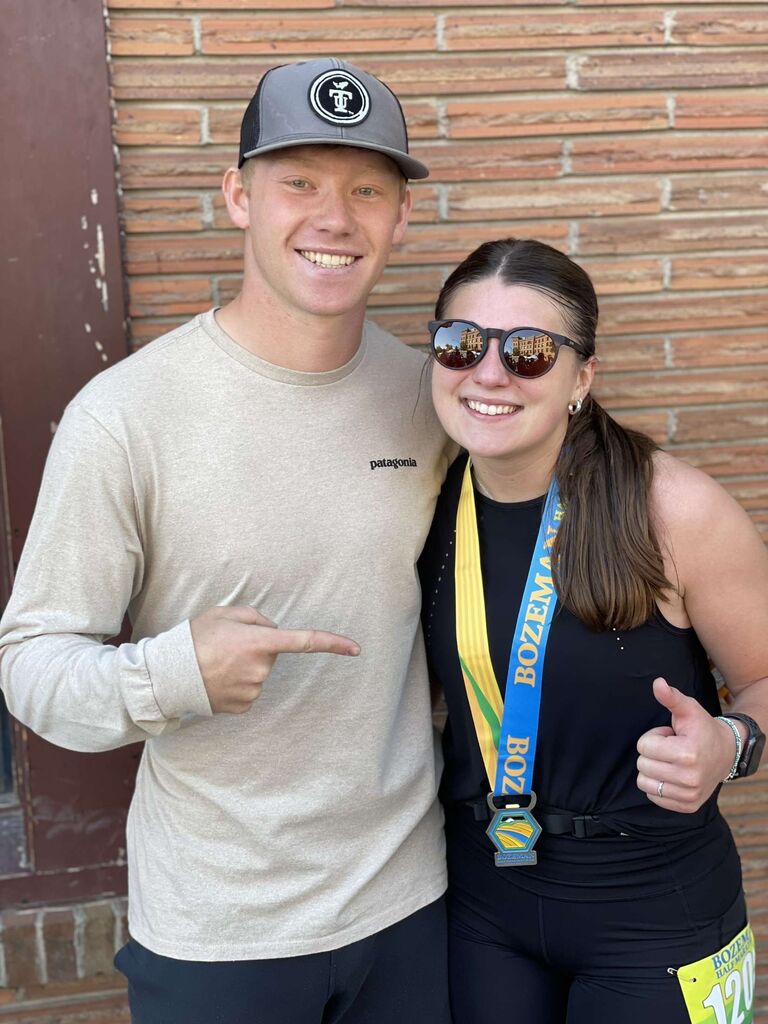 Brock supporting Addy after her first Half-Marathon