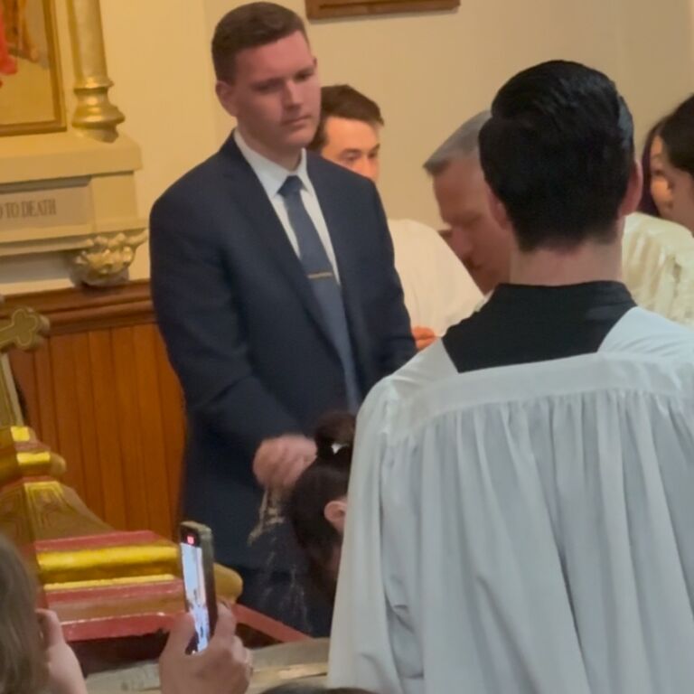After 6 months of classes, Mikayla is finally baptized into the Catholic Church. Tom Lonsway (best man) decides on purpose to stand in front of the picture wearing a dress