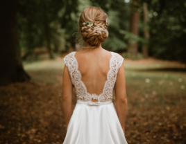 Bride with low bun braided wedding hairstyle