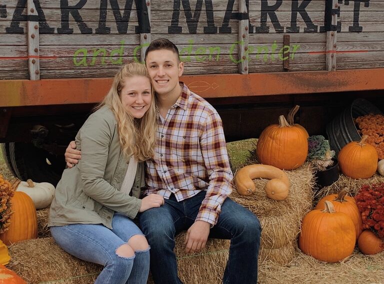Ailsa dragging Greg to the pumpkin patch to see the goats