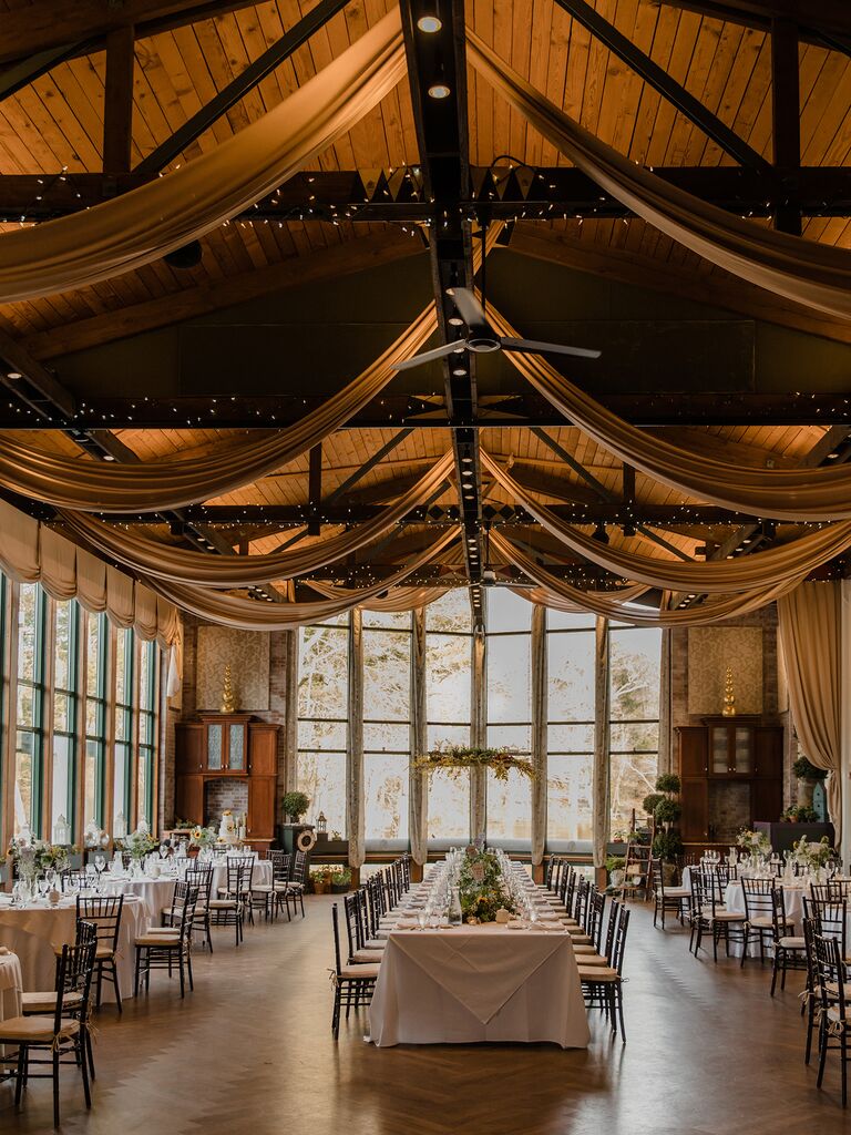 rustic new england wedding venue with vaulted wooden ceilings and large windows