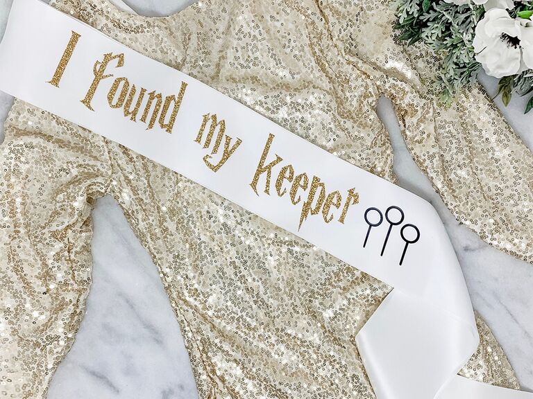 'I found my keeper' in gold sparkly Harry Potter font with keeper graphics