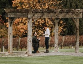 Couple in love hiking in wood for Thanksgiving proposal