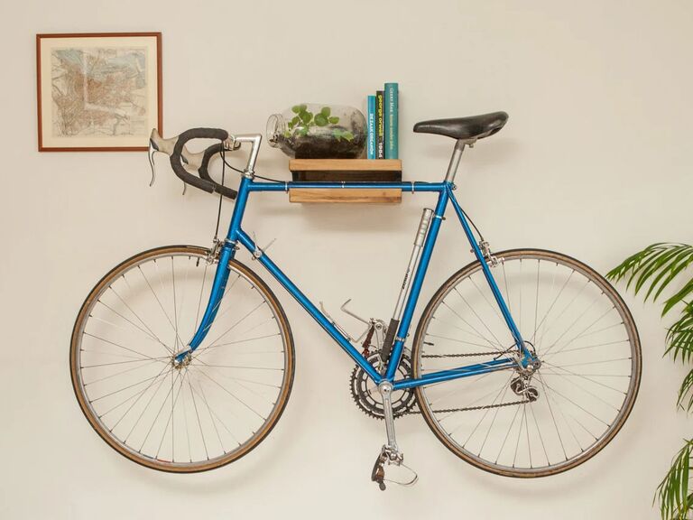 Wooden floating shelf storing bicycle unique biophilic design idea