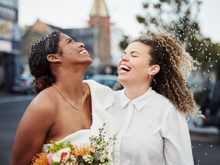 Couple on wedding day smiling and laughing together