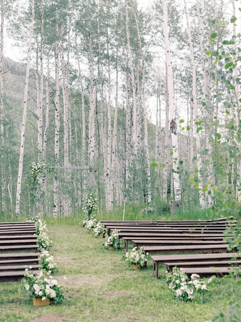 Bench ceremony seating at outdoor venue, taylor swift themed wedding