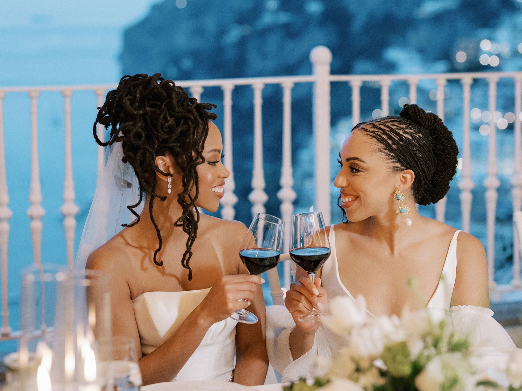 Two brides with formal hairstyles at wedding
