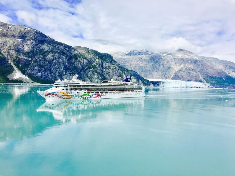 Cruise ship passing mountains