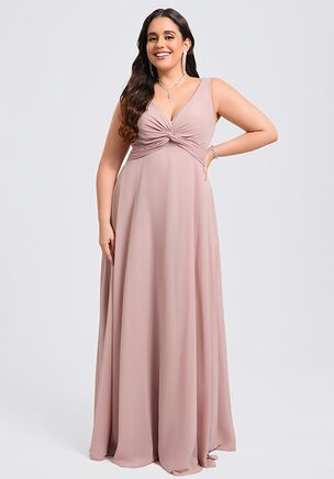 This bridesmaid dress is a stunning choice crafted from soft chiffon. It features a flattering V-neckline and a delicately twisted bodice that enhances every figure. The flowing A-line skirt adds elegance and grace, making it a perfect option for any special occasion.