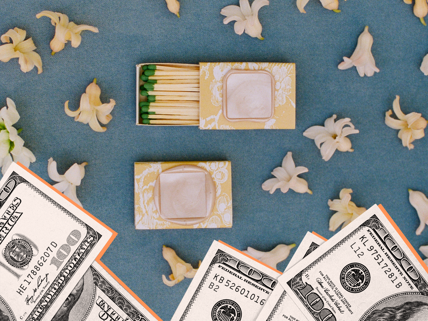 Matchbox wedding favor surrounded by flowers and cash