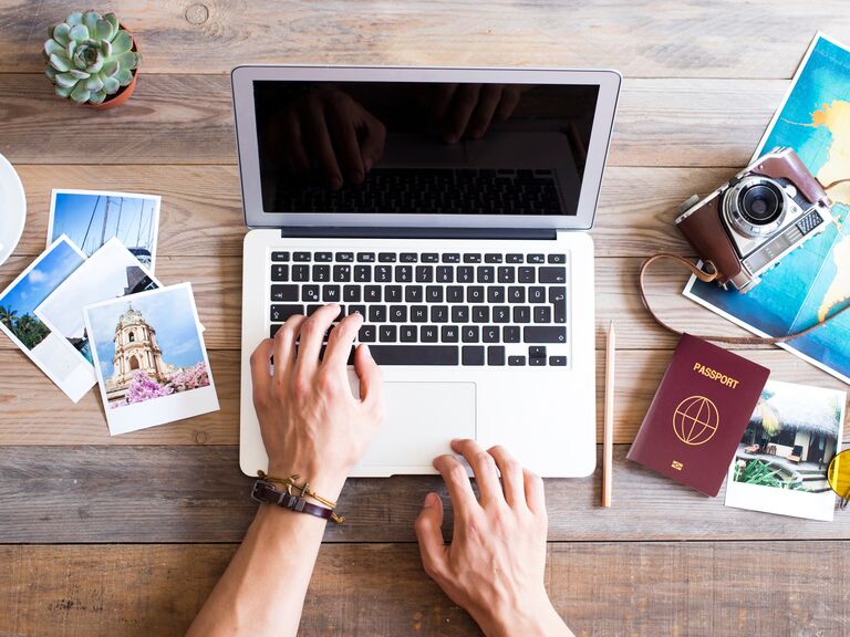 Person planning honeymoon on computer