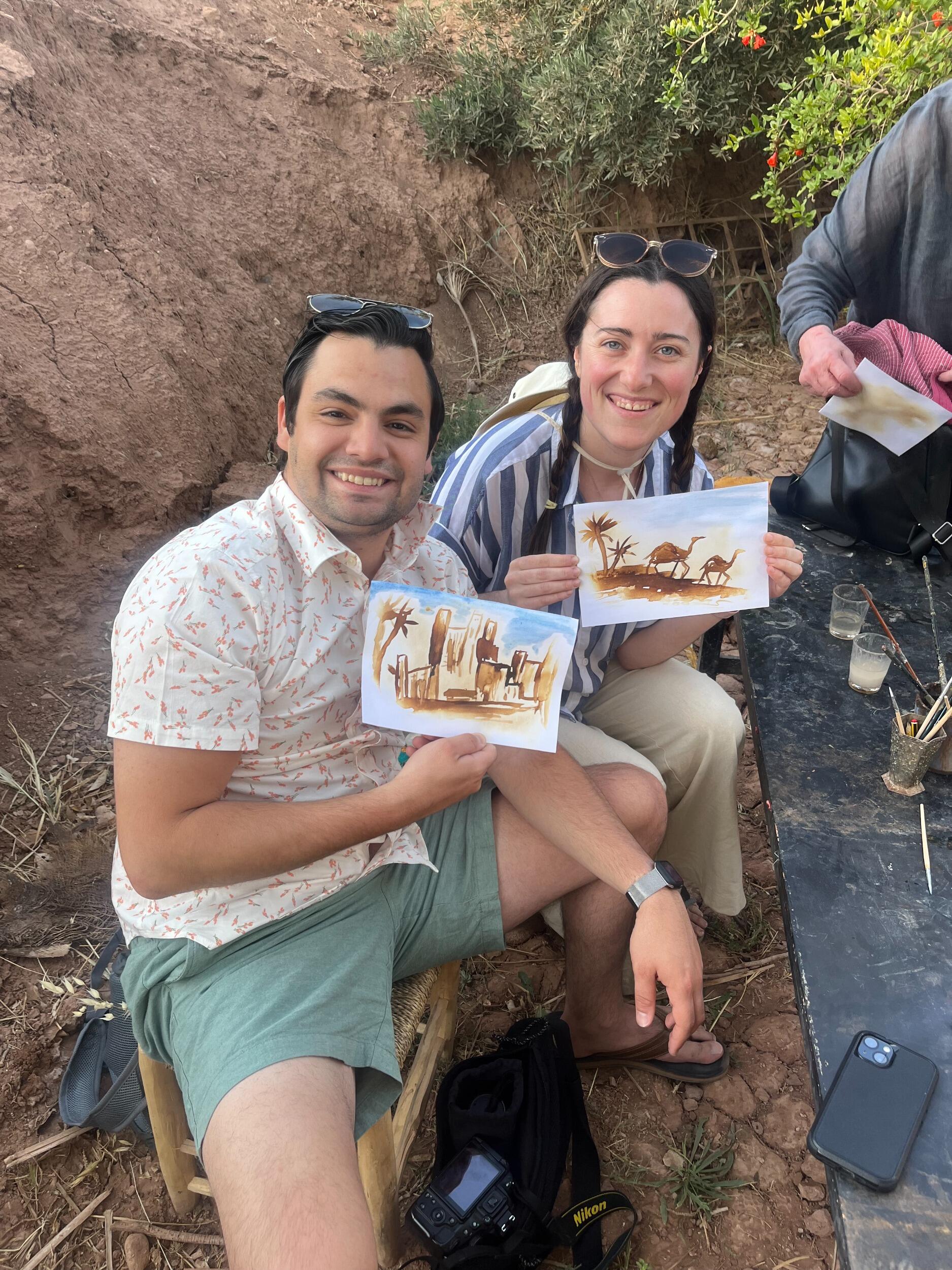 Trying our lemon juice painting skills out with a local artist in Morocco