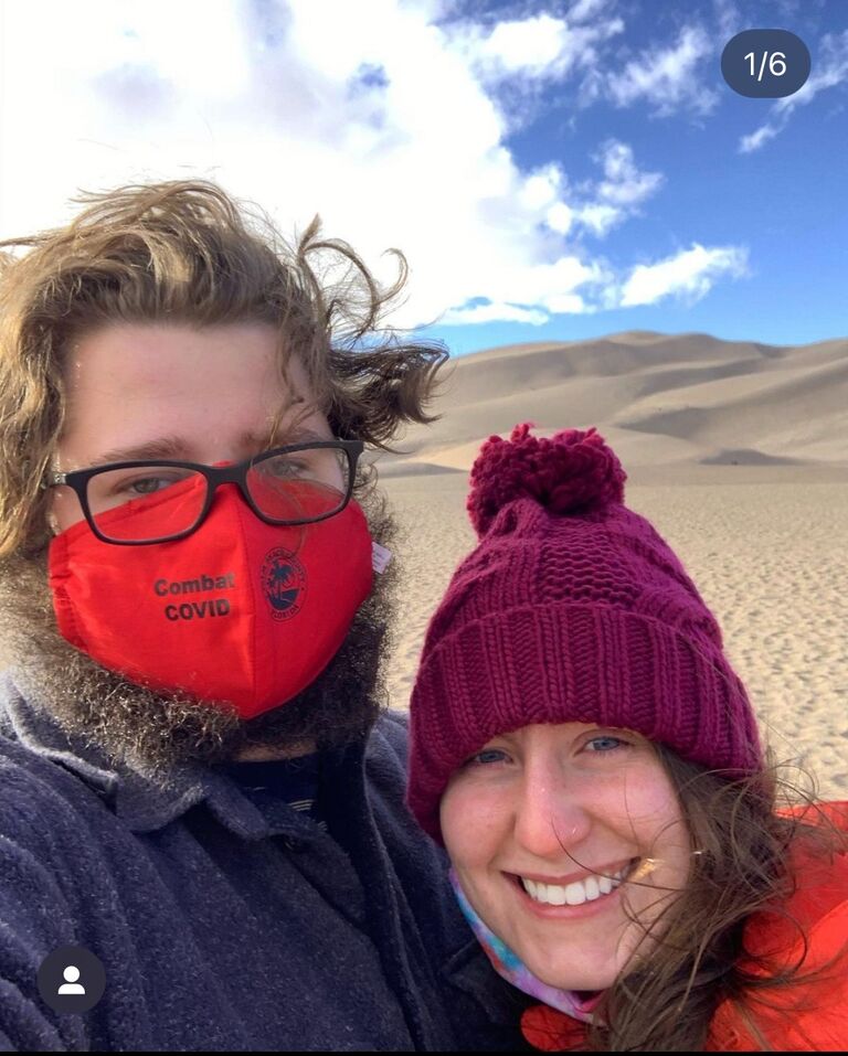 Us in Great Sand Dunes National Park, Colorado, driving back from our ski trip. 