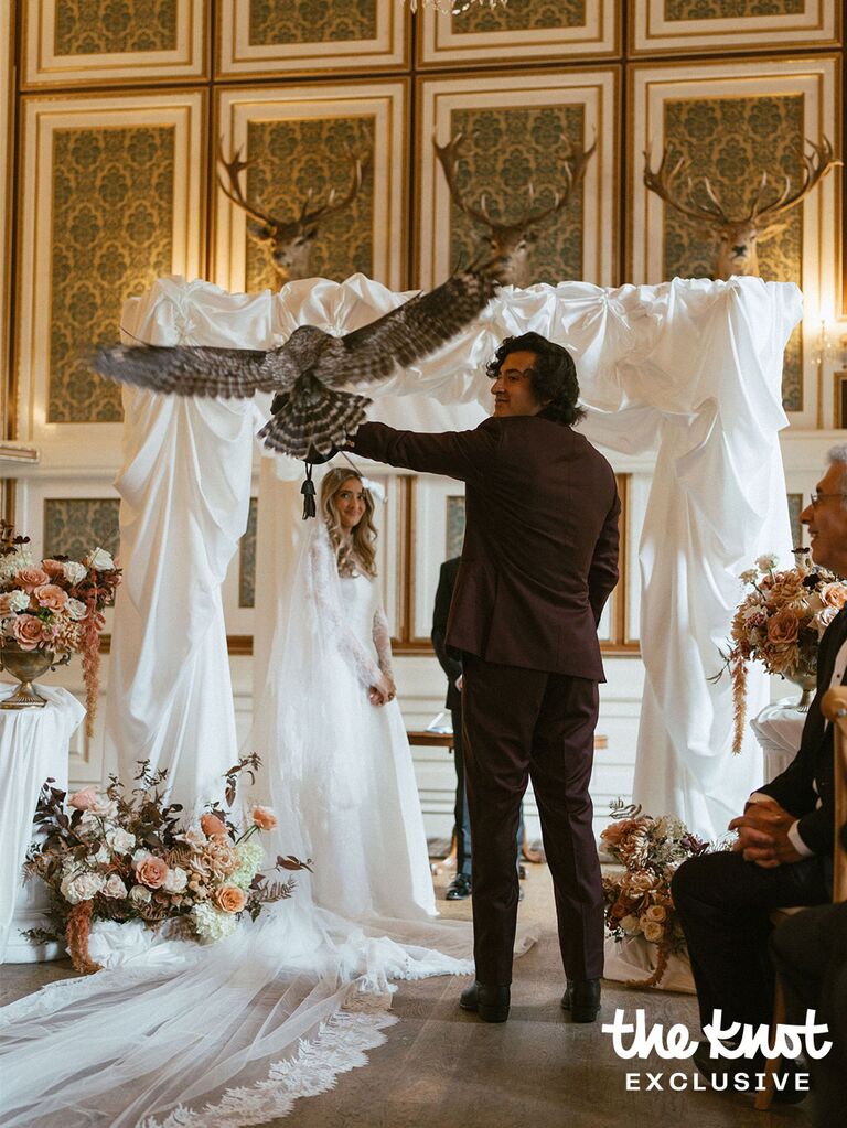 Owl landing on Joey Kurbanov's arm during his wedding ceremony