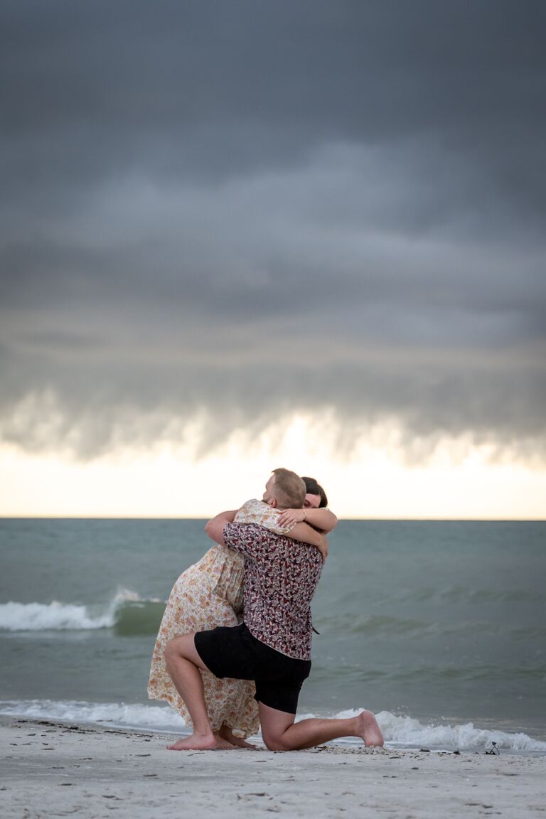 After 6 years, Gordon asked Amelia to marry him on their favorite sunset beach.