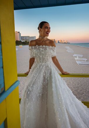 Indulge in the ultimate romance with this breathtaking A-line wedding dress. The delicate lace fabric is adorned with stunning 3D flowers that add texture and dimension, creating a truly unique and unforgettable look. The corseted bodice, completed with a sweetheart neckline, flatters your figure and accentuates your curves. The detachable bolero or straps offer versatility and allow you to customize the dress to your liking. The A-line silhouette flows effortlessly, ensuring comfort and ease of movement. This dress is the perfect choice for the bride who wants to feel both feminine and free-spirited, and create a memorable impression on her special day.