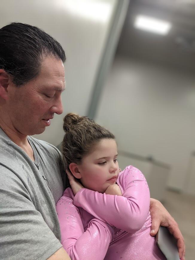 More hanging out, this time at Makayla's dance class at the church.  She wasn't feeling well so she fell asleep on Daddy's lap.