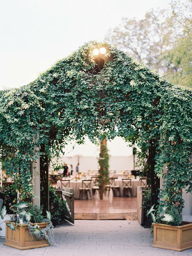 disney themed wedding greenery arch