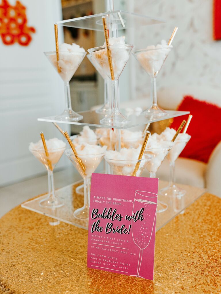 tower of martini glasses with cotton candy and gold straws