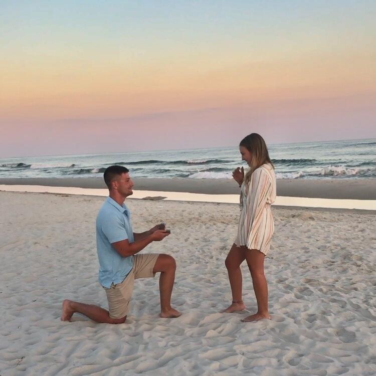 After almost 2 years of officially dating, Caleb popped the question on the beach, while they were on vacation in Gulf Shores, Alabama. They are looking forward to starting this new chapter of life together, and cannot wait to celebrate with all of their favorite people! 