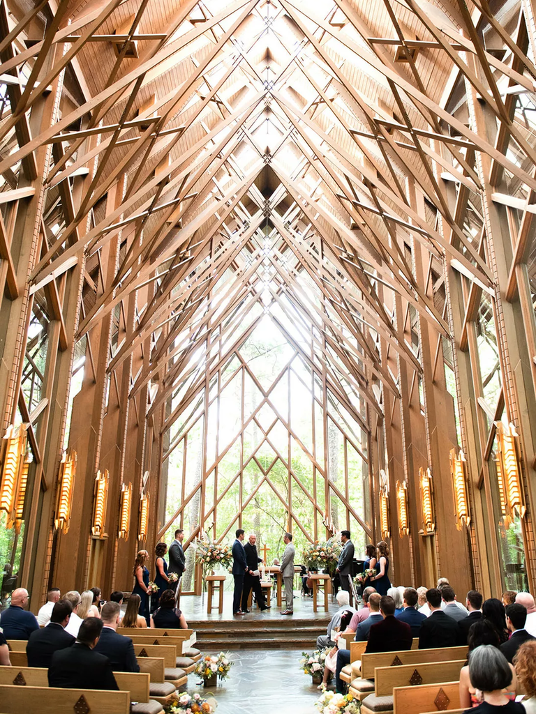 A couple tie the knot in this indoor ceremony space at Anthony Chapel in Hot Springs, Arkansas