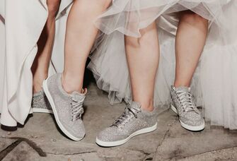 Brides wearing sparkly wedding sneakers on wedding day