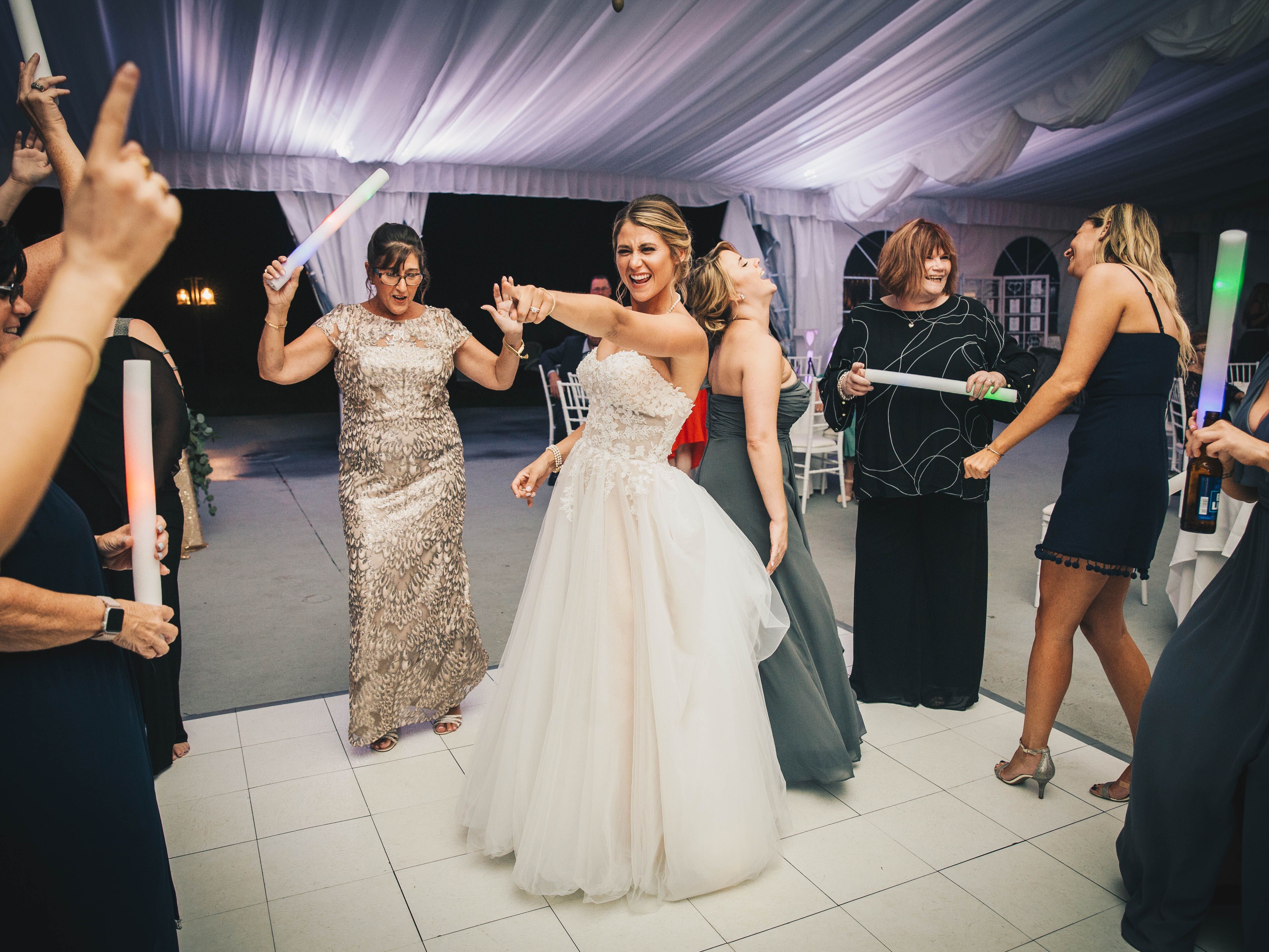 Bride dancing with her guests on the dance floor