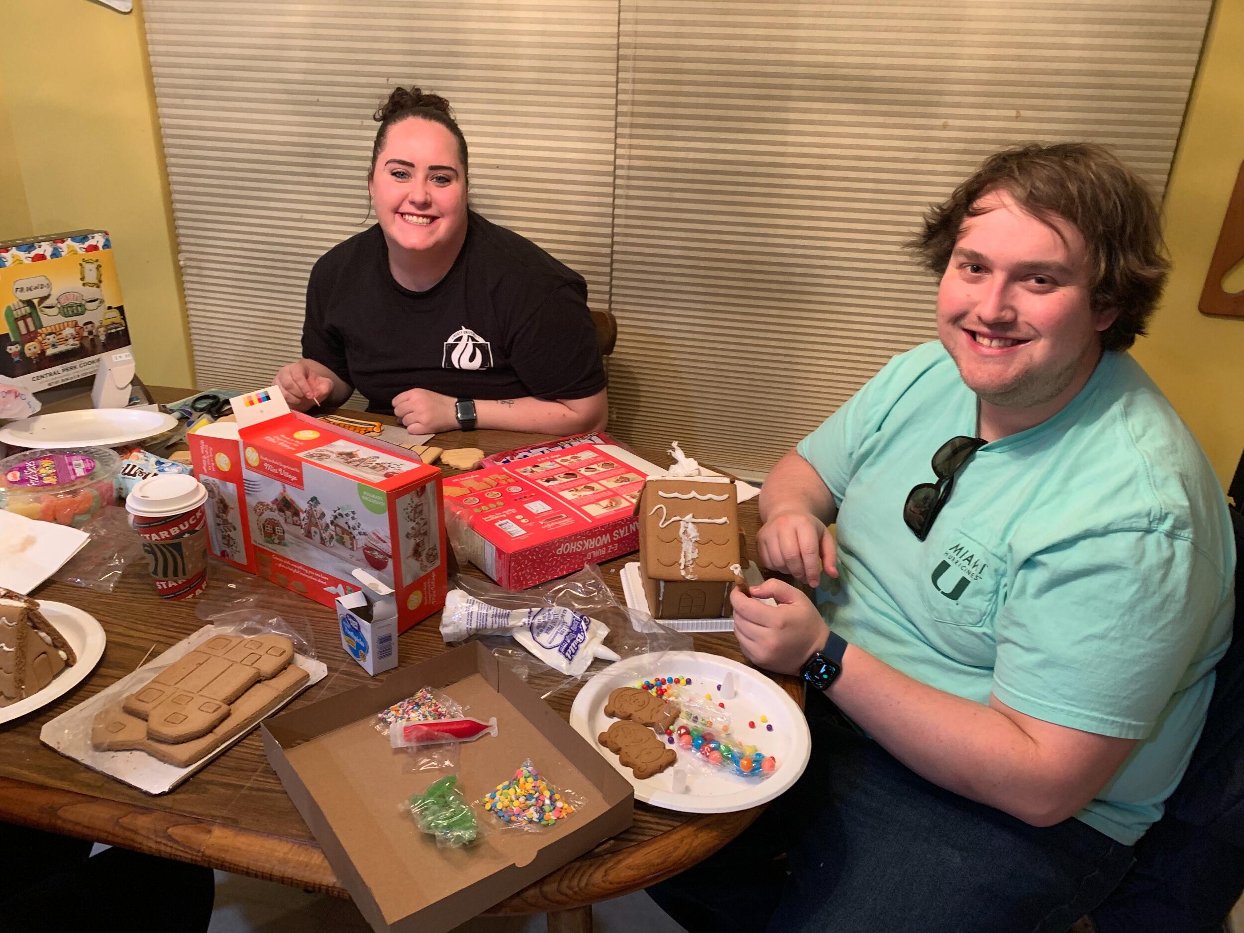 They spent part of their first Xmas decorating gingerbread houses. Sarah got very frustrated with hers. 
