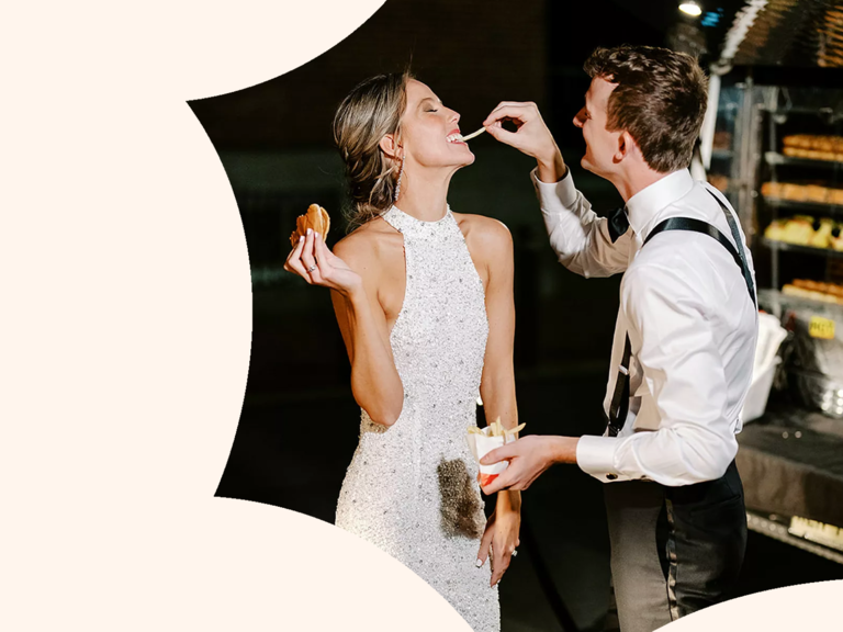 Couple eating late night snack at wedding