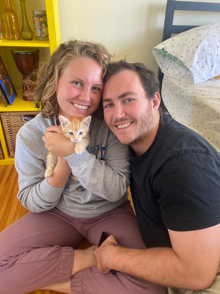 Soon after their move, Christopher and Ellie's family expanded with the addition of a fiery, cuddly, and energetic orange tabby cat. They named him Burton Guster, inspired by a character from one of their favorite TV shows, Psych.