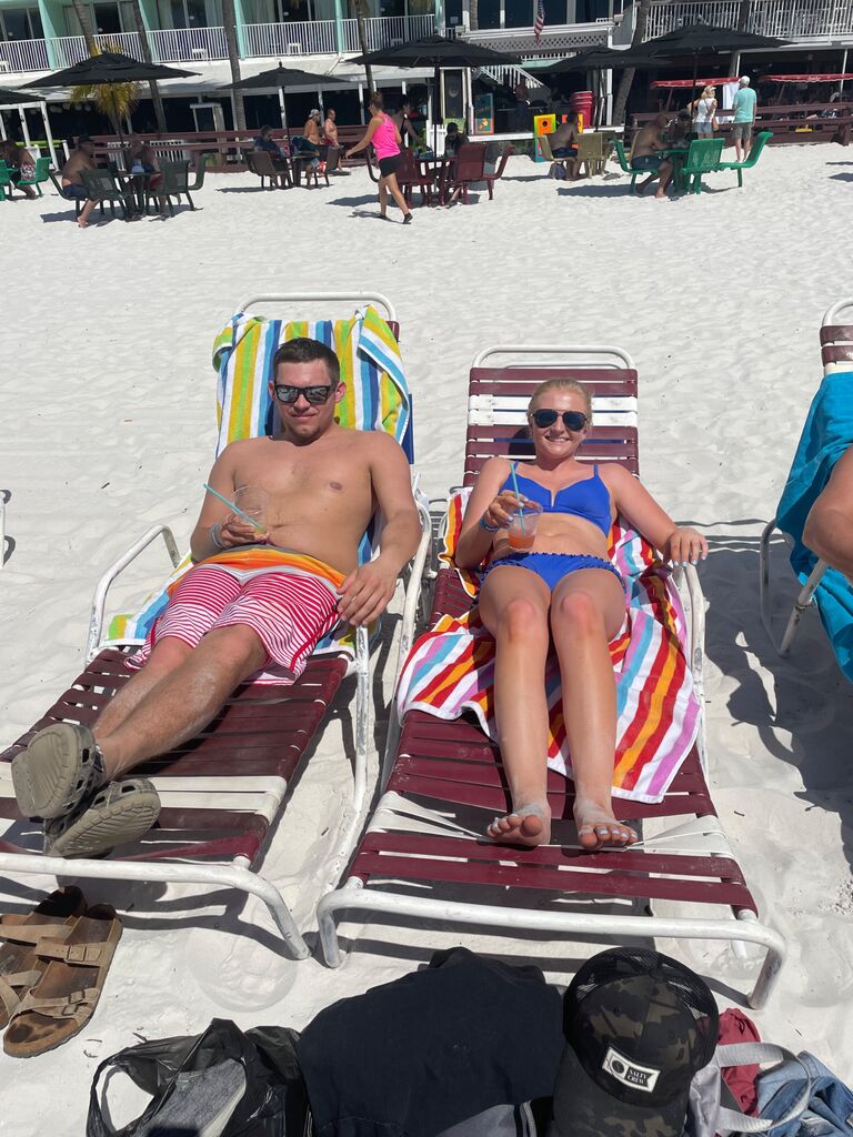 Lounging on a beach in Ft. Myers Beach, FL! Our first getaway together!