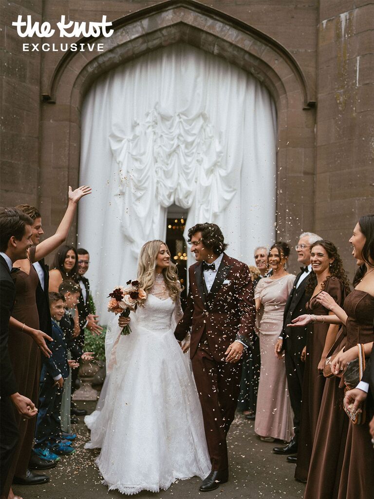 Logan Rae Hill and Joey Kurbanov exiting their wedding under confetti