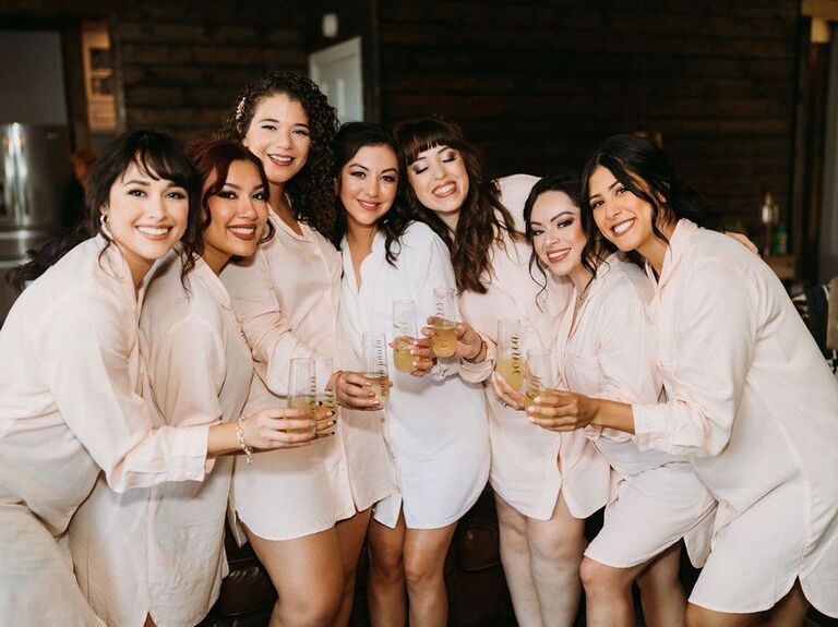 Bride and her bridesmaids enjoying some refreshments in their robes
