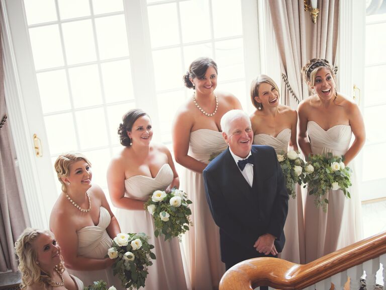 Bridesmaids and the bride's father's reaction to seeing her for the first time