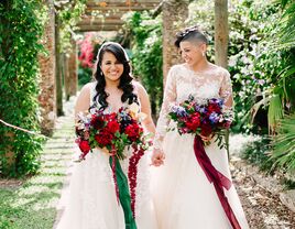 Newlyweds under botanical archway in Florida